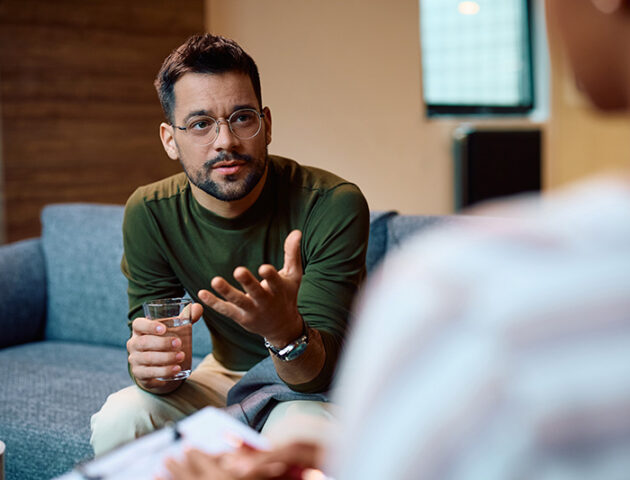 A man participates in therapy for trauma.