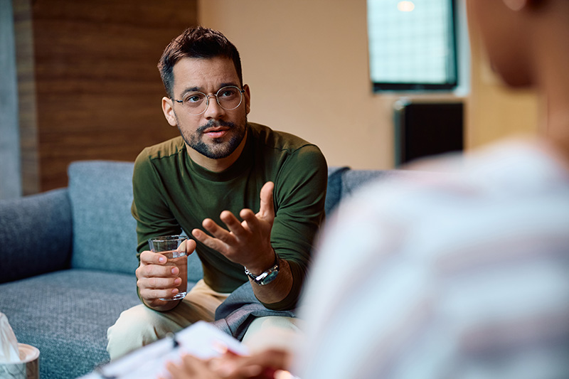 A man participates in therapy for trauma.